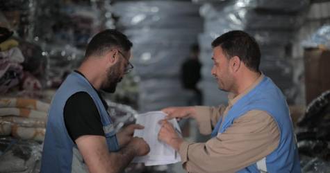 UNRWA staff providing supplies